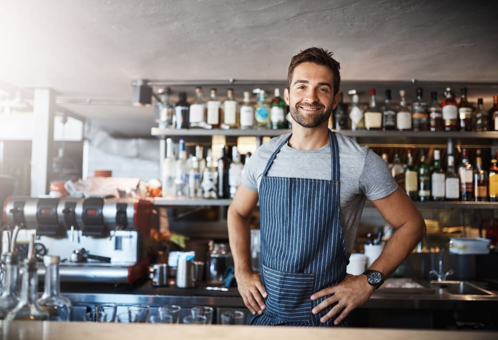 Bartender,,Man,And,Happy,In,Portrait,At,Counter,With,Service